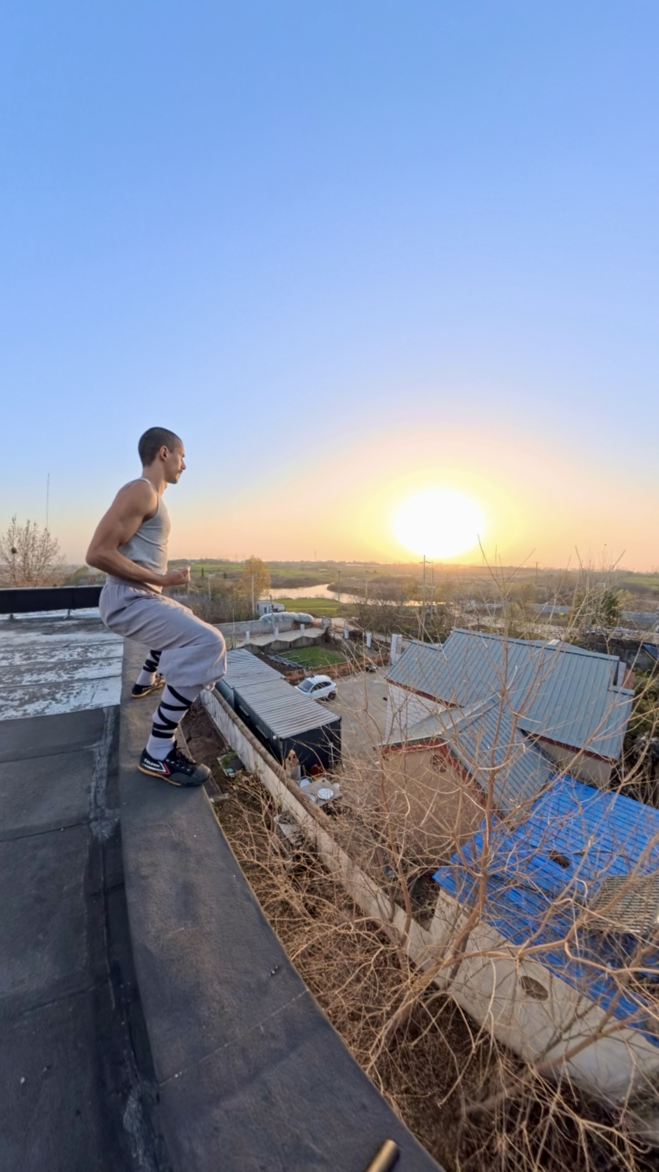 Ken on rooftop at sunset